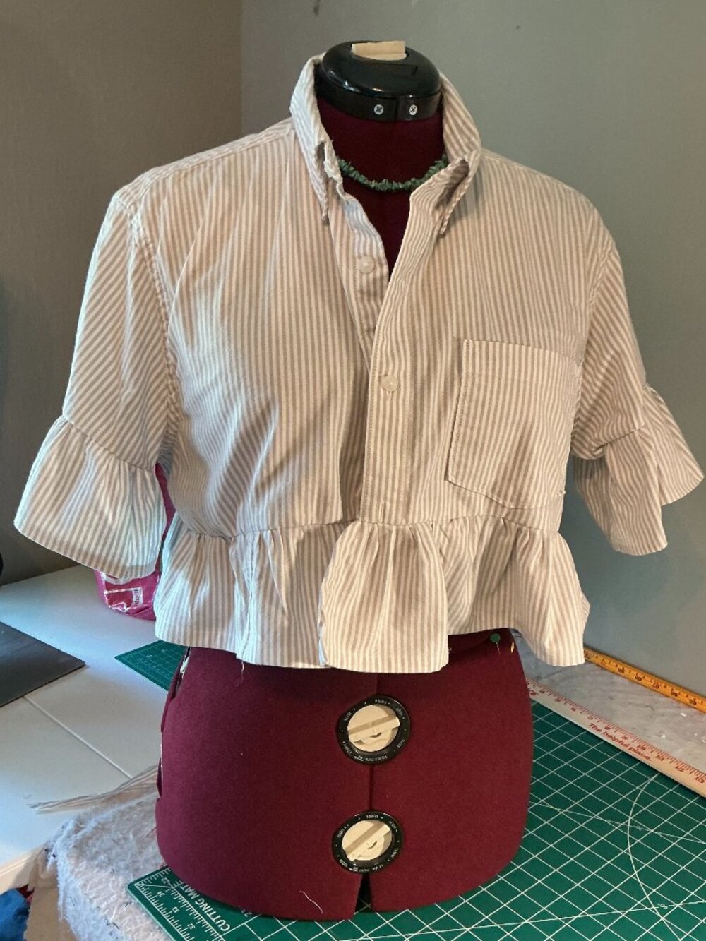 Upcycled cropped Mensa shirt with ruffled collar bottom and bell sleeves